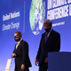 U.S. Special Presidential Envoy for Climate John Kerry (R) with COP26 President Alok Sharma walking off stage.